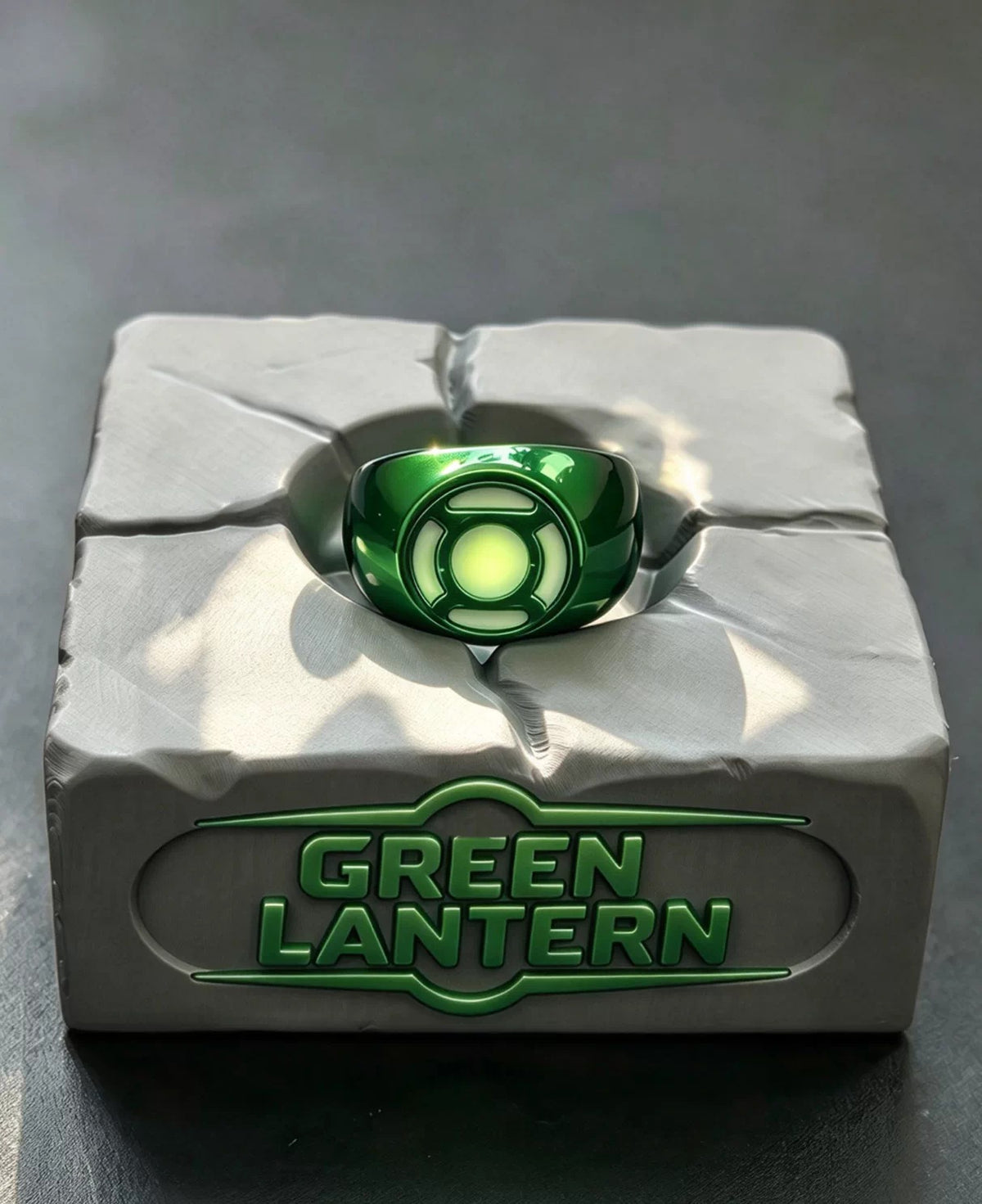 Classic green ring with matching green-lettered display stand